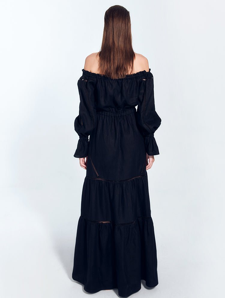 Back View: Model in Jealine Black Dress - MOEVA Luxury Swimwear, Embroidery Details, Off-The-Shoulder Neckline, Ready to Wear, Unlined, Comfort, Linen, MOEVA Luxury Swimwear