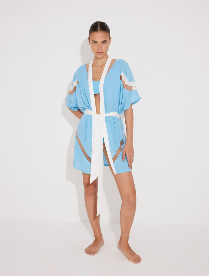 Front View: Model in Jennifer Blue/White Kaftan - MOEVA Luxury Swimwear, Thigh Length, Mesh Details, Duo Colored, Detachable Belt,  MOEVA Luxury Swimwear