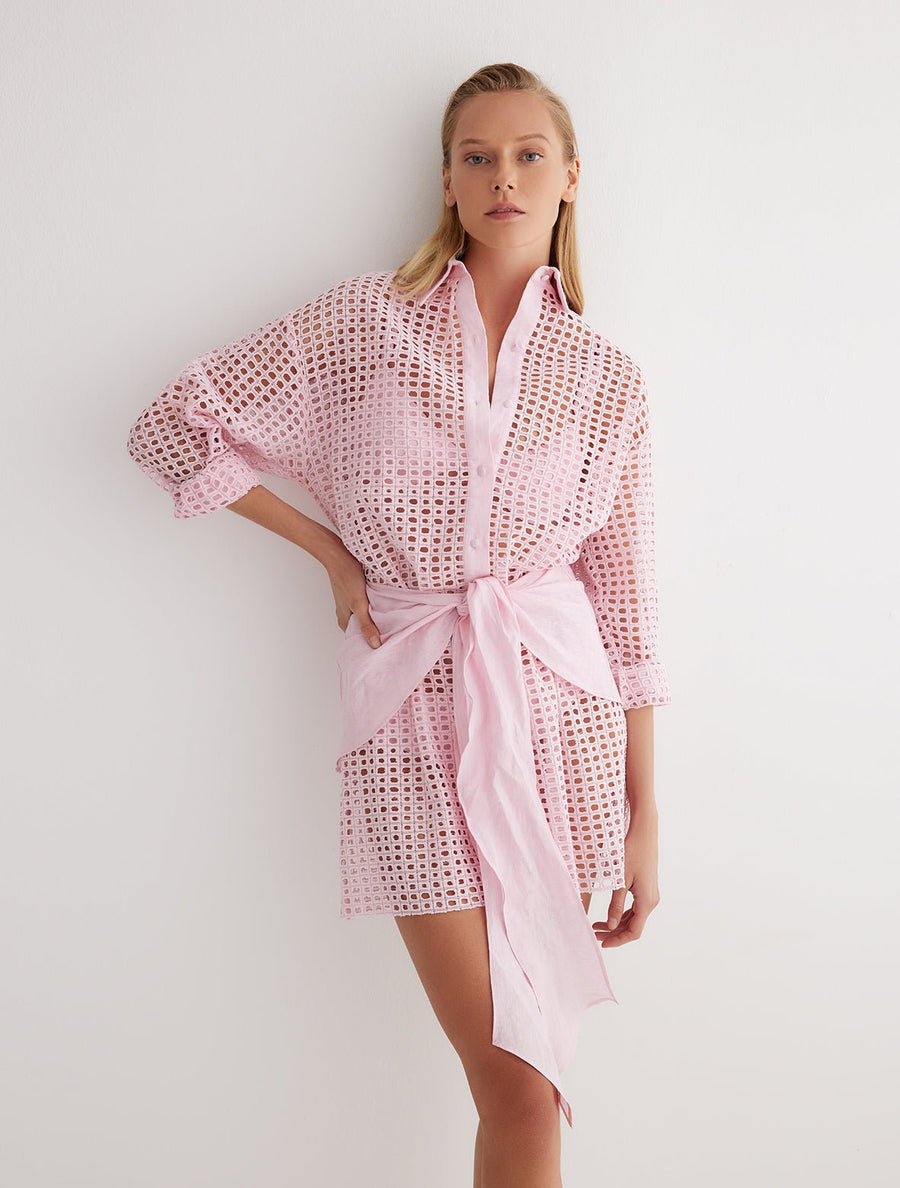 Front View: Model in Jesabel Pink Dress - MOEVA Luxury Swimwear, Broderie Anglaise Fabric, Button Fastening Through Front, Layered with Panel, Tie at the Front, MOEVA Luxury Swimwear