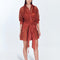 "Jesabel Red Ochre Mini Shirt Dress – Front View, featuring luxury Broderie Anglaise cotton with a button front, pointed collar, and waist tie for a refined vacation look."
