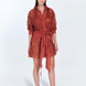 "Jesabel Red Ochre Mini Shirt Dress – Front View, featuring luxury Broderie Anglaise cotton with a button front, pointed collar, and waist tie for a refined vacation look."
