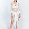 Front View: Model in Jesabel White Dress - MOEVA Luxury Swimwear, Broderie Anglaise Fabric, Button Fastening Through Front, Layered with Panel, Day to Night Mini Dress, MOEVA Luxury Swimwear