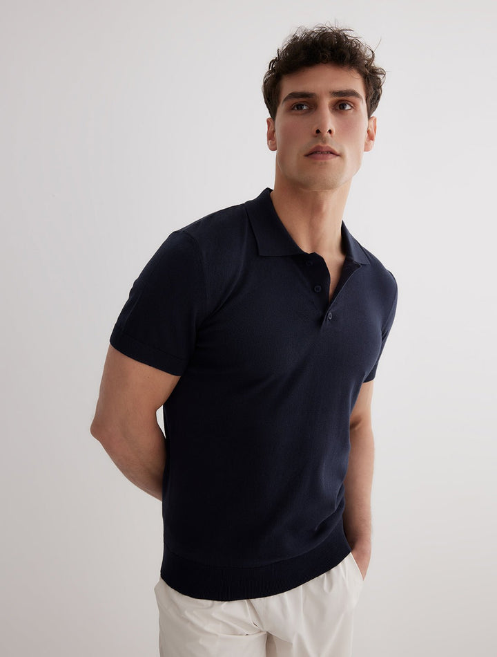 Front View: Model in Johan Dark Blue Polo Shirt - MOEVA Luxury Swimwear, Open Collar, Polo Shirt, Short-Sleeved, Cashmere & Cotton-Blend, Slim Fit, MOEVA Luxury Swimwear