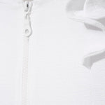 Close-up of the ruffle detailing and fabric texture, illustrating the playful design elements.