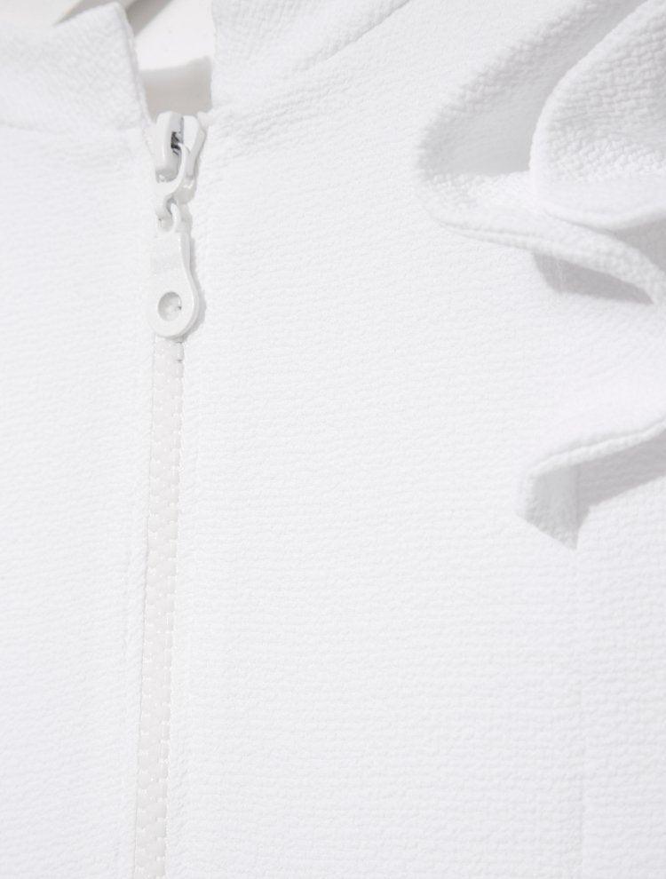 Close-up of the ruffle detailing and fabric texture, illustrating the playful design elements.