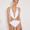 Front View: Jolanda White Monokini on Model - Tie Neck Swimsuit, Moderate Bottom Coverage, Italian Fabric, Crushed Round Gold Accessory, MOEVA Luxury Swimwear