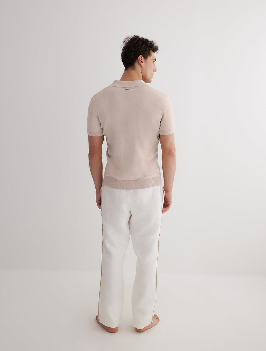 Back View: Model in Joseph White Pants - MOEVA Luxury Swimwear, Relaxed Fit, Muslin Fabric, MOEVA Luxury Swimwear