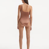 Back view of the Kaimana Brown Swimsuit, demonstrating the full bottom coverage and flattering fit