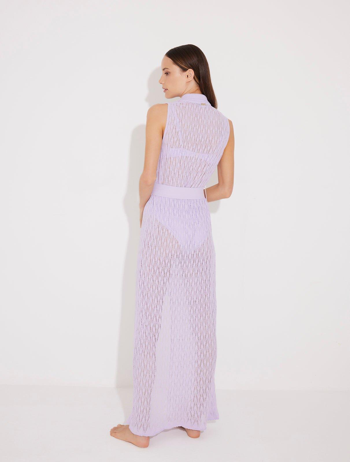 "Back view of the Kariba Kaftan on a model, illustrating the flowy silhouette and elegant pattern.