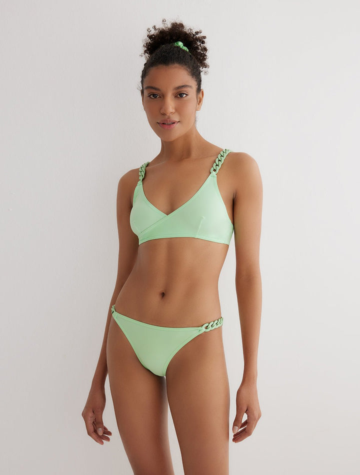 Front View: Model in Karin Mint Green Bikini Bottom - MOEVA Luxury Swimwear, Fully Lined, Accessorised, Soft Touch Fabric, ABS Chain Side Straps, Low Rise, Small Coverage, MOEVA Luxury Swimwear