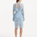"Back view of the Kenga Baby Blue Kaftan emphasizing the knee-length design and the graceful movement of the fringe details."