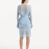 "Back view of the Kenga Baby Blue Kaftan emphasizing the knee-length design and the graceful movement of the fringe details."