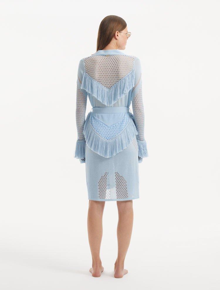 "Back view of the Kenga Baby Blue Kaftan emphasizing the knee-length design and the graceful movement of the fringe details."