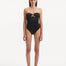 Discover the enchanting intersection of fashion, art, and athleticism with the Kenna Black Swimsuit. Crafted as part of our groundbreaking collection, this exquisite piece invites you to immerse yourself in a narrative that fuses the dynamism of sports and the fluid grace of water, offering a fresh take on elegance and empowerment.   Minimalist Silhouette The Kenna black swimsuit exudes sophistication and modernity with its striking strapless design. This silhouette pays tribute to the fluid nature of water