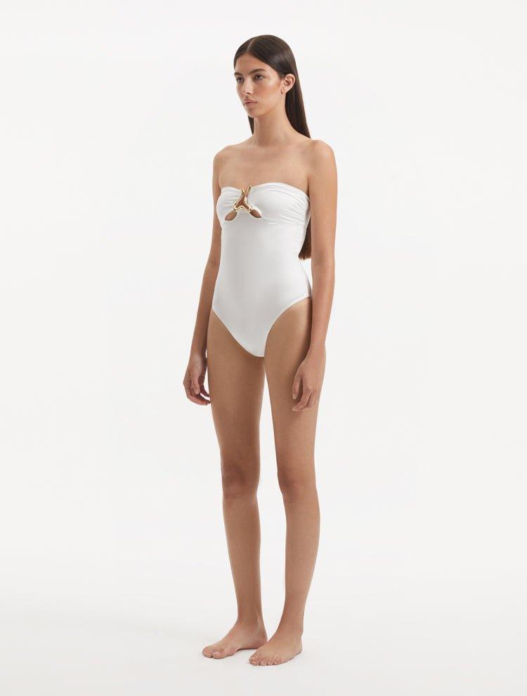 Side view of the Kenna White Swimsuit, emphasizing the sleek strapless design and its flattering fit.