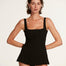 "Model wearing the Kimberley Seersucker Black Swimsuit from the front, showcasing its ballerina-inspired design with a fitted waist and short circle skirt."