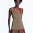  "Kimberley Shiny Green Swimsuit front view showing the ballerina-inspired design with a waist-cinched dress and skirt."