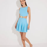 "Front view of the Lanao blue cut-out knitted dress showcasing the high neck, thigh-length hem, and torso-baring cut-outs at the waist with a gold accessory for an elegant look."