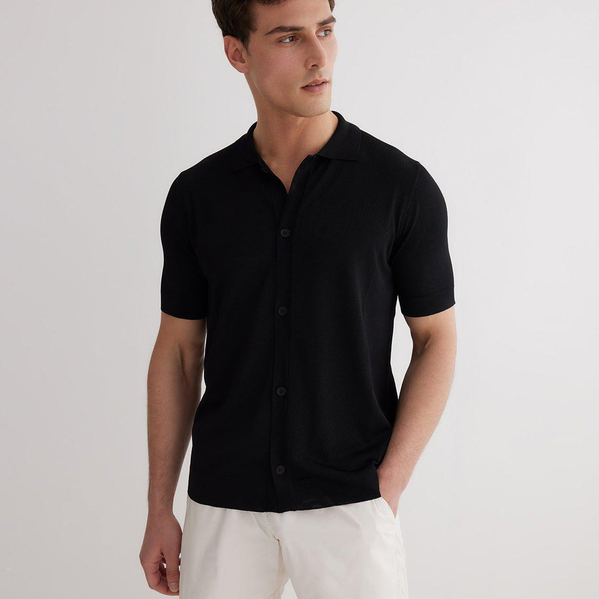 Lars Black Polo Shirt with Button Fastening | Moeva | T-Shirt | Each week unveils new pieces—luxury swimwear, fluid resort silhouettes, and elevated summer-to-evening essentials designed to carry you from coastal escapes to city nights.