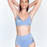 Front View: Model in Leana Blue Bikini Bottom - Satin Matte Contrast, High Rise, Moderate Coverage, Fully Lined, MOEVA Luxury Swimwear