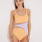 Front View: Model in Lelia Orange/Lilac Swimsuit - MOEVA Luxury Swimwear, Mesh Details, Fully Lined, Removable Padding, Italian Fabric, Special Lycra Xtralife Certificate, MOEVA Luxury Swimwear 