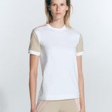 "Front view of a model wearing the Leticia White Top, showcasing its modern style."