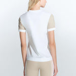 "Back view of the Leticia White Top on a model, emphasizing its flattering silhouette."