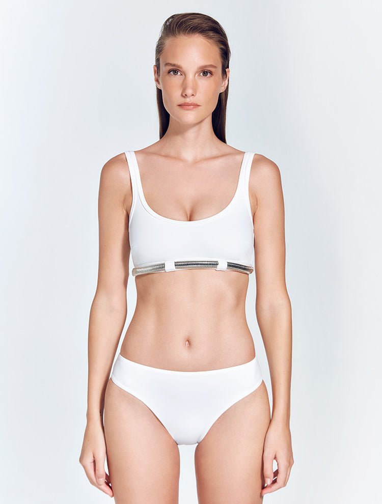 Front View: Model in Liliana White Bikini Top  - MOEVA Luxury Swimwear, Scoop Neck, Omega Chain Accessory, MOEVA Luxury Swimwear