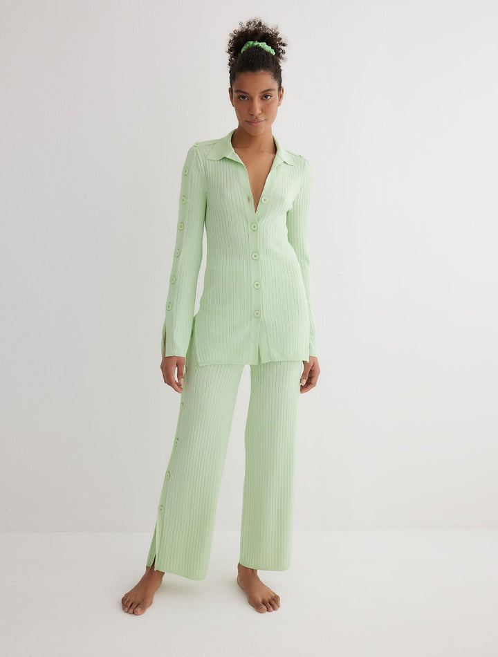 Front View: Model in Lilou Mint Green Pants - MOEVA Luxury Swimwear, Knitted Pants, Button Details in the Sides, High Waisted, Close Fit, Ankle Length, MOEVA Luxury Swimwear