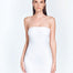 Front View: Model in Logan White Dress - MOEVA Luxury Swimwear, Strapless Neck, Close Fit, Mid-Thigh Length, Fully Lined, MOEVA Luxury Swimwear