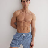 Front View: Model in Louis Blue Mirage Shorts - MOEVA Luxury Swimwear, Close Fitting, Lightweight Fabric with Quick Drying, Pockets at the Front, Drawstring Waist, Quick Dry,  MOEVA Luxury Swimwear