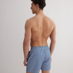 Back View: Model in Louis Blue Mirage Shorts - MOEVA Luxury Swimwear, Men	Swim Shorts, Nikel, Mid Length Swim Shorts, Fully Lined, Slim Fit, Quick Dry, MOEVA Luxury Swimwear