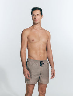 Front View: Model in Louis Khaki Swim Shorts - MOEVA Luxury Swimwear, Close Fitting, Lightweight Fabric with Quick Drying, Pockets at the Front, Drawstring Waist, Quick Dry,  MOEVA Luxury Swimwear