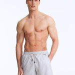 Front View of Model Wearing Louis Light Grey Shorts - MOEVA Luxury Swimwear, Close Fitting, Lightweight Fabric with Quick Drying, Pockets at the Front, MOEVA Luxury Swimwear