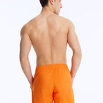 Back View: Louis Orange Shorts on Model - Drawstring Waist, Mid Length, Quick Dry, MOEVA Luxury Swimwear   