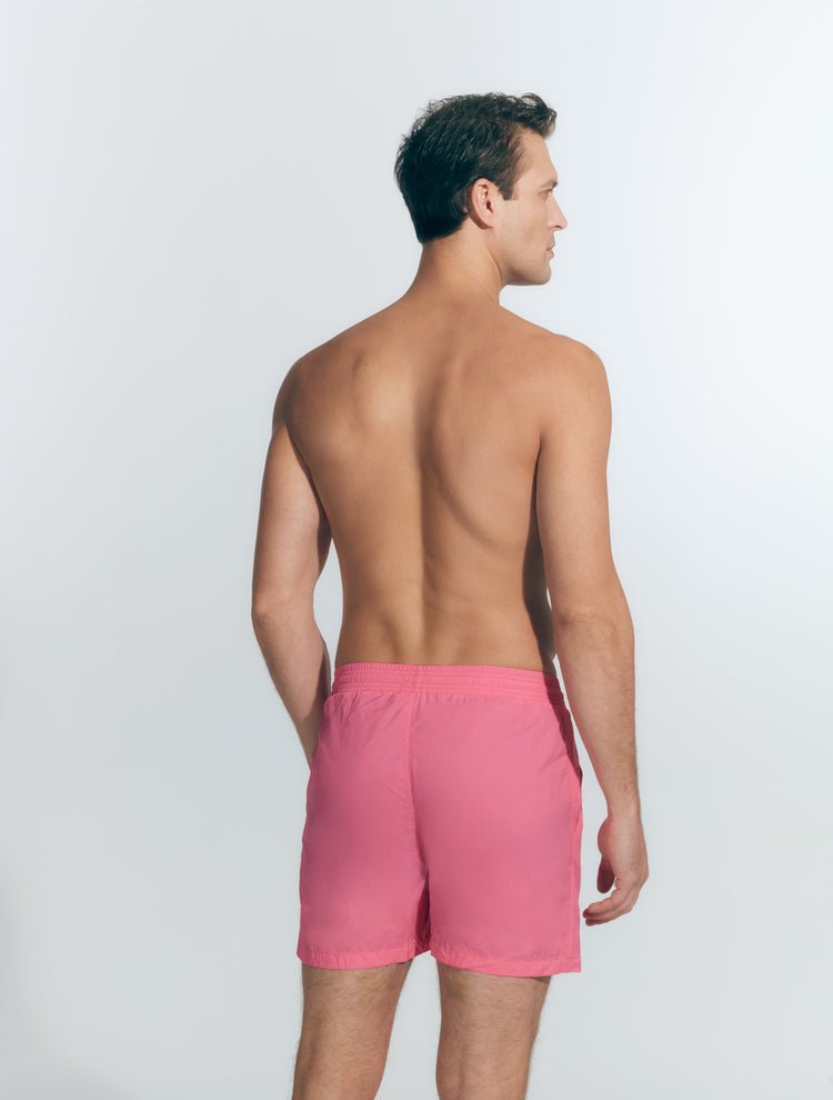 Back View: Model in Louis Pink Shorts - MOEVA Luxury Swimwear, Men Swim Shorts, Nikel, Mid Length Swim Shorts, Fully Lined, Slim Fit, Quick Dry, MOEVA Luxury Swimwear