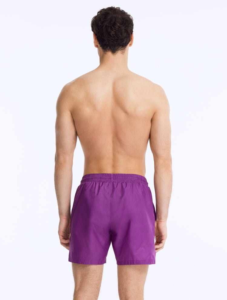 Front View of Model Wearing Louis Purple Shorts - MOEVA Luxury Swimwear, Close Fitting, Lightweight Fabric with Quick Drying, Pockets at the Front, MOEVA Luxury Swimwear