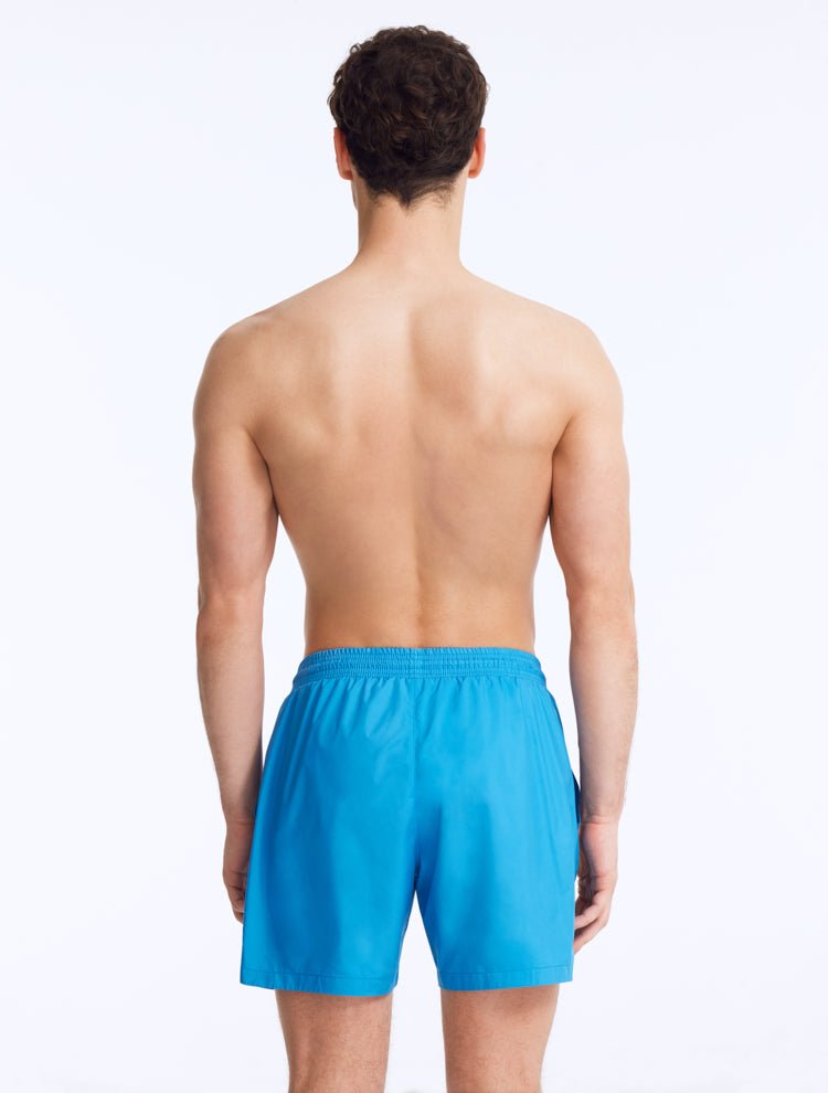 Back View: Louis Teal Swim Shorts on Model - MOEVA Luxury Swimwear, Drawstring Waist, Mid Length, Quick Dry, MOEVA Luxury Swimwear   