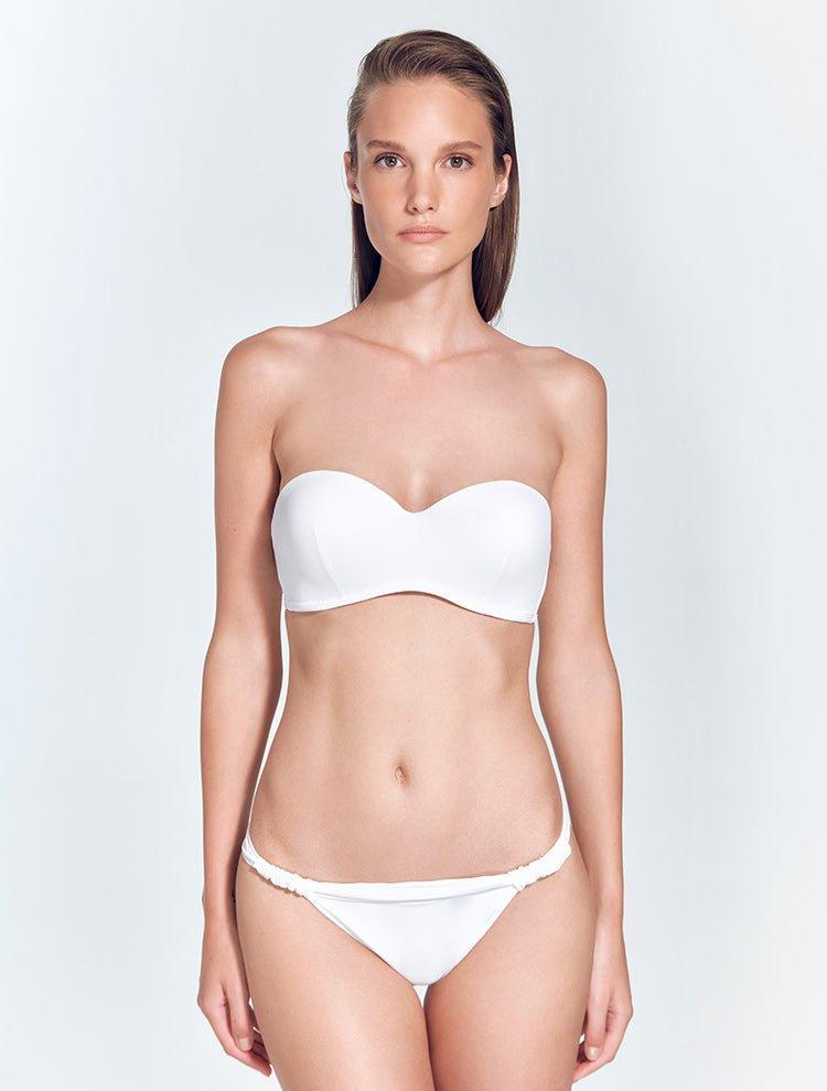 "Model wearing the Lucille Bikini Bottom from the front. The low-rise bottom features a sleek design and fully lined construction for a comfortable fit."