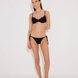 Front View: Model in Luigiana Black Bikini Bottom - MOEVA Luxury Swimwear, Low Waist, Side-Tie, Gold Stopper, Stitching Details, Moderate Bottom Coverage, MOEVA Luxury Swimwear  
