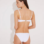 Back View: Model in Luigiana White Bikini Bottom - MOEVA Luxury Swimwear, Fully Lined, Italian Fabric, Special Lycra Xtralife Certificate, Side Tie Low-Waist Black Bikini Bottom,  MOEVA Luxury Swimwear  
