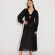 "Front view of a model wearing the Lula Black Maxi Dress, showcasing its classic silhouette and blouson sleeves."