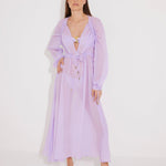 "Front view of a model wearing the Lula Lilac Maxi Dress, showcasing its classic silhouette and blouson sleeves."