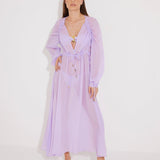 "Front view of a model wearing the Lula Lilac Maxi Dress, showcasing its classic silhouette and blouson sleeves."