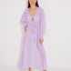"Front view of a model wearing the Lula Lilac Maxi Dress, showcasing its classic silhouette and blouson sleeves."