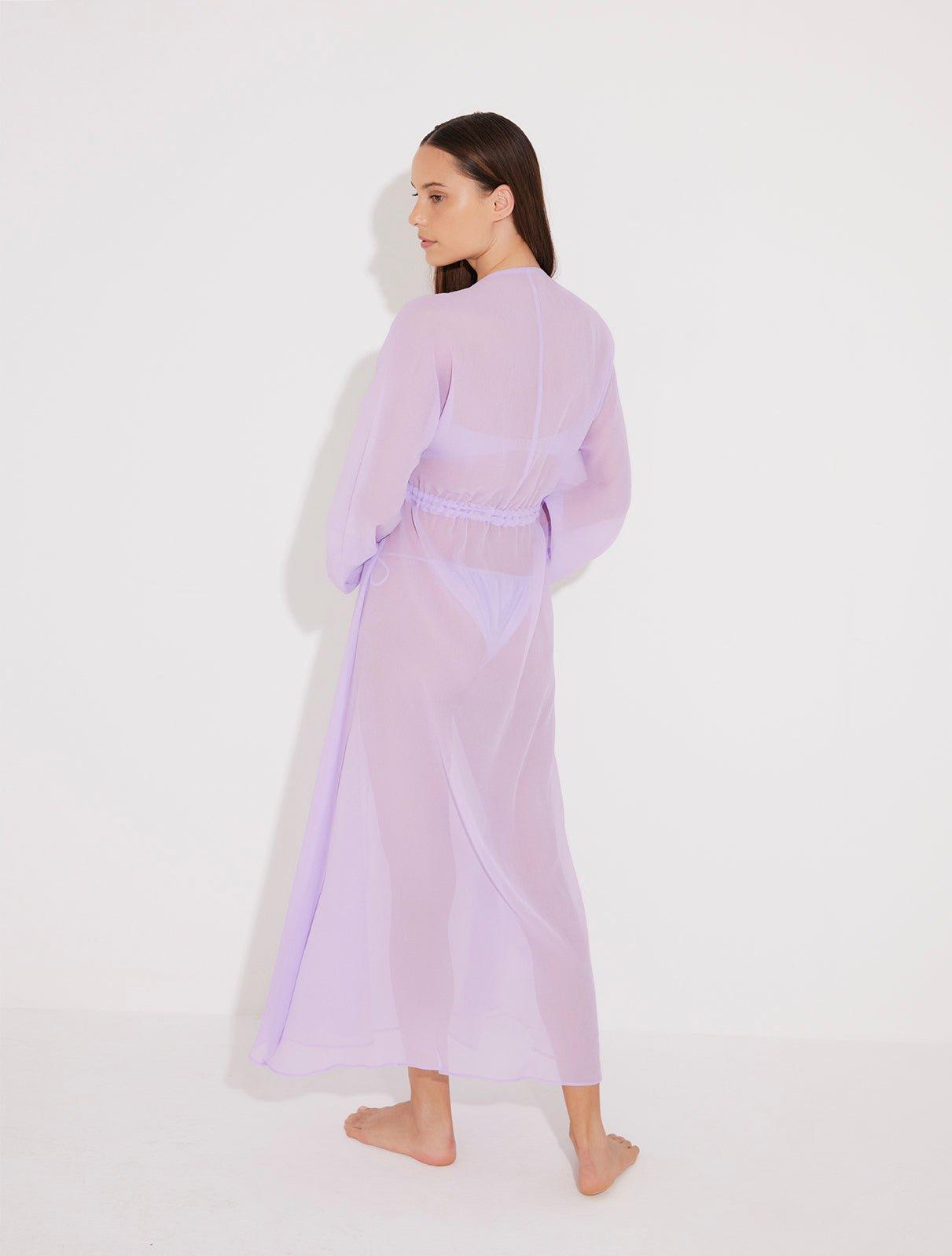 "Back view of the Lula Lilac Maxi Dress, highlighting the deep v-neckline and sheer silk fabric."