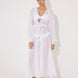 "Front view of a model wearing the Lula White Maxi Dress, showcasing its classic silhouette and blouson sleeves."