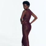"Back view of Luna Prune Dress displaying intricate crochet pattern."