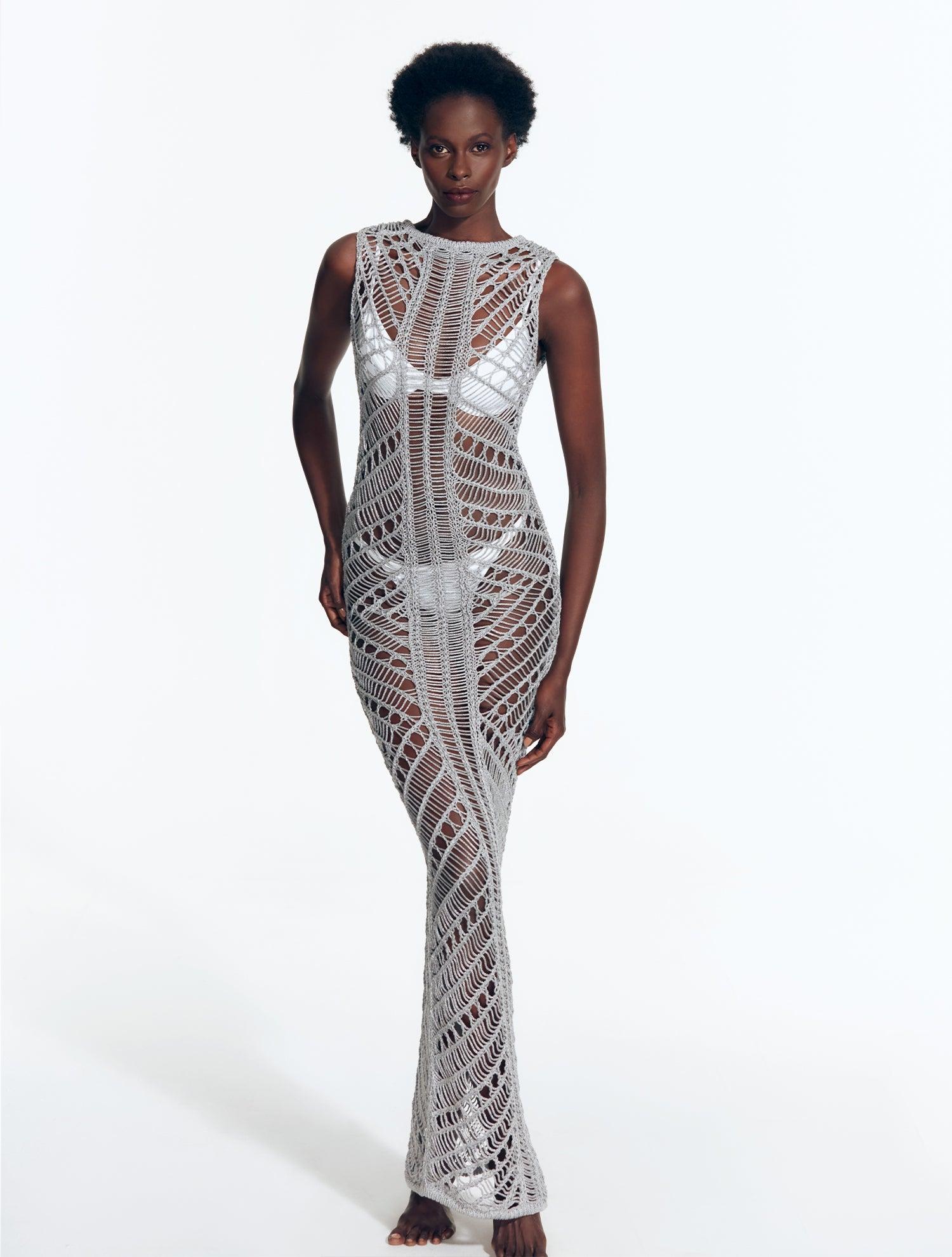 "Model wearing Luna Silver Crochet Dress from the front, highlighting the floor-length design and scoop neckline."