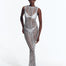 "Model wearing Luna Silver Crochet Dress from the front, highlighting the floor-length design and scoop neckline."